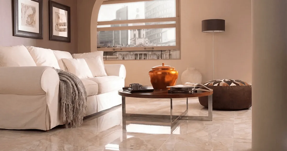 Modern living room with professionally installed marble flooring, a beige sofa, coffee table in Memphis, TN